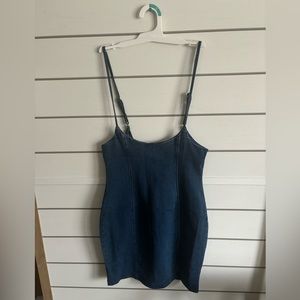 Dark Blue Jean Dress. Zipper on the back.
Open back with spaghetti straps.